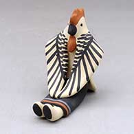 A sitting chicken figure
 by Loren Wallowing Bull of Jemez