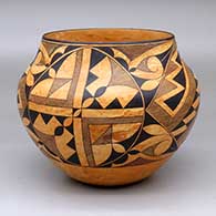 A black-on-mixed clay jar decorated with a four-panel fine line and geometric design
 by Calvin Analla Jr of Laguna