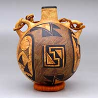 A black-on-mixed clay canteen decorated with a fine line and geometric design
 by Calvin Analla Jr of Laguna