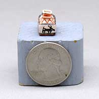 A miniature polychrome two-opening jar decorated with an animal and geometric design, click or tap to see a larger version