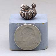 A miniature sculpted three-bird jar
 by Thomas Natseway of Laguna