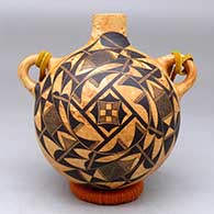 A black-on-mixed-clay round-backed canteen with handles and decorated front and back with a fine line and geometric design
 by Calvin Analla Jr of Laguna