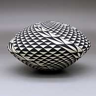 A black on white seed pot decorated with a spiral mesa and geometric design, click or tap to see a larger version