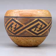 A polychrome mixed clay bowl decorated with a band of fineline and geometric design around the body, click or tap to see a larger version