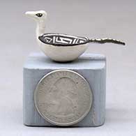 A miniature black on white bird bowl decorated with a Mimbres and geometric design, click or tap to see a larger version