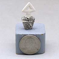 A miniature black on white lidded rectangular jar with a cutout in the lid and and decorated with a fineline and geometric design
 by Thomas Natseway of Laguna
