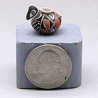 A miniature polychrome bird effigy pot decorated with a geometric design
 by Thomas Natseway of Laguna