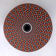 Click for a larger view A polychrome seed pot decorated with a spiral checkerboard geometric design
by Robert Kasero Sr of Laguna