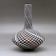 A polychrome tall neck seed pot decorated with a spiral mesa geometric design, click or tap to see a larger version