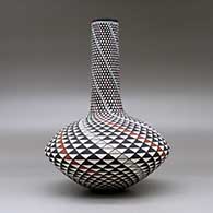 A polychrome tall neck seed pot decorated with a spiral mesa geometric design, click or tap to see a larger version