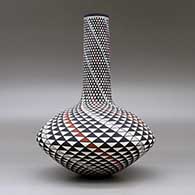 A polychrome tall neck seed pot decorated with a spiral mesa geometric design, click or tap to see a larger version