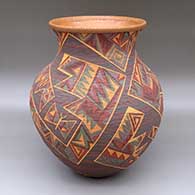 A polychrome tiny coil jar decorated with a sgraffito and painted geometric design
 by Richard Zane Smith of Wyandot