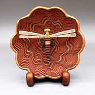 A polychrome lazy coil bowl with a dragonfly, on a custom stand
 by Richard Zane Smith of Wyandot