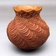 A polychrome lazy coil jar with notched coils and a scalloped opening
 by Richard Zane Smith of Wyandot