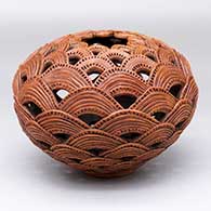 A brown jar made of notched and grooved rainbow appliques
 by Richard Zane Smith of Wyandot