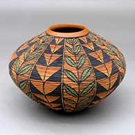 Click for a larger view A polychrome tiny coil jar decorated with a twelve panel plant and geometric design
by Richard Zane Smith of Wyandot