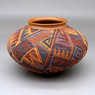 Click for a larger view A polychrome tiny coil jar with a flared rim and decorated with a locks and keys geometric design
by Richard Zane Smith of Wyandot