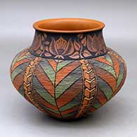 Click for a larger view A polychrome tiny coil jar with a short neck decorated with a leaf and geometric design, a flared rim and decorated below the neck with a locks and keys geometric design on the tiny coils
by Richard Zane Smith of Wyandot