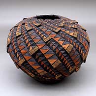 Click for a larger view A polychrome tiny coil jar with a notched rim and decorated with appliques and a geometric design
by Richard Zane Smith of Wyandot