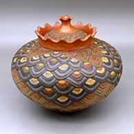 Click for a larger view A polychrome lidded lazy coil jar with a crowned rim and decorated with a geometric design
by Jamie Zane Smith of Wyandot