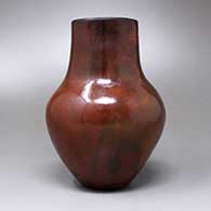A polished brown vase with fire clouds and a pine pitch coating, click or tap to see a larger version