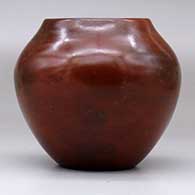 A polished brown jar decorated with fire clouds, click or tap to see a larger version