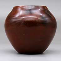 A polished brown jar decorated with fire clouds, click or tap to see a larger version