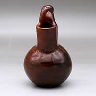 A brown wedding vase with fire clouds and a twisted bridge, click or tap to see a larger version