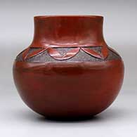 A brown jar with a sgraffito geometric design above the shoulder, click or tap to see a larger version