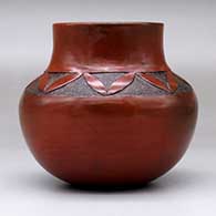 A brown jar with a sgraffito geometric design above the shoulder, click or tap to see a larger version