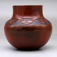 A brown jar with a sgraffito geometric design above the shoulder, click or tap to see a larger version
