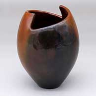 A brown jar with a geometric cut opening and fire clouds
 by Alice Cling of Dineh