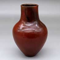 A brown vase decorated with fire clouds
 by Alice Cling of Dineh