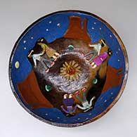 A polychrome bowl decorated inside with Navajo countryside in the nighttime and Dine dancers around a campfire
 by Elizabeth Manygoats of Dineh