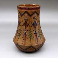 A low-shouldered polychrome jar decorated below the shoulder with a Navajo carpet design pattern and above the shoulder with a Yeibichai, corn plant and geometric design
 by Nancy Yazzie of Dineh