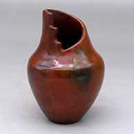 A polished brown vase with a kiva step cut opening and decorated with fire clouds
 by Alice Cling of Dineh