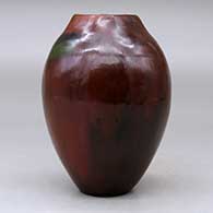 A polished brown vase with a square opening and decorated with fire clouds, click or tap to see a larger version