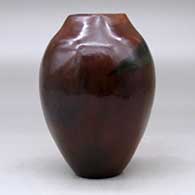 A polished brown vase with a square opening and decorated with fire clouds, click or tap to see a larger version
