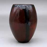 A polished brown vase decorated with fire clouds, click or tap to see a larger version