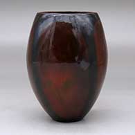 A polished brown vase decorated with fire clouds, click or tap to see a larger version