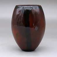 A polished brown vase decorated with fire clouds, click or tap to see a larger version
