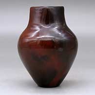 A polished brown vase decorated with fire clouds and a short, square neck, click or tap to see a larger version