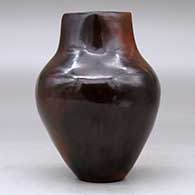 A polished brown vase decorated with fire clouds and a short, square neck, click or tap to see a larger version