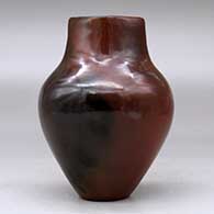A polished brown vase decorated with fire clouds and a short, square neck, click or tap to see a larger version