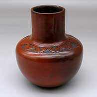 A polished brown jar with fire clouds decorated above the shoulder with a sgraffito geometric design
 by Sue Williams of Dineh