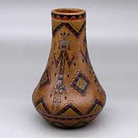 Click for a larger view A polychrome vase with a tall neck and decorated with a sgraffito and painted yeibichai and geometric design
by Nancy Yazzie of Dineh