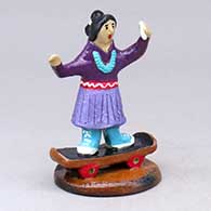 A Dineh woman on a skateboard taking a selfie
 by Elizabeth Manygoats of Dineh