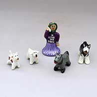 A Dineh dog walker out with four dogs
 by Elizabeth Manygoats of Dineh