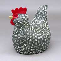 A polychrome sitting chicken figure
 by Elizabeth Manygoats of Dineh