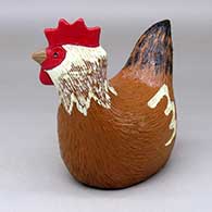 A polychrome sitting chicken figure
 by Elizabeth Manygoats of Dineh